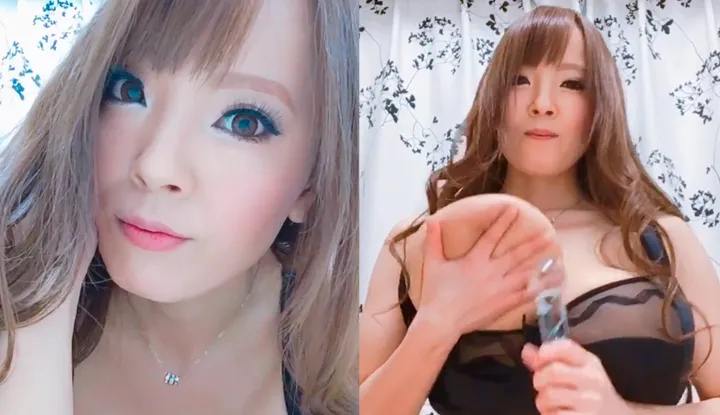 Hitomi picks up the transparent rods and squeezes her massive breasts.