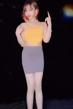 The long-legged sister dances a hot dance.