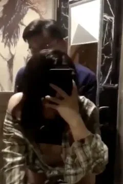 Being taken from bend in front of the bathroom mirror