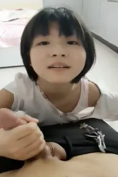 Girlfriend with short hair has great skill playing the flute.