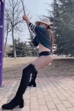 Little fox who loves to show off, playing on a swing
