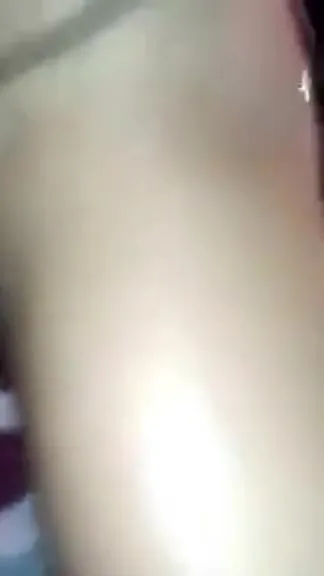 Man sticks out tongue and licks in a nightclub