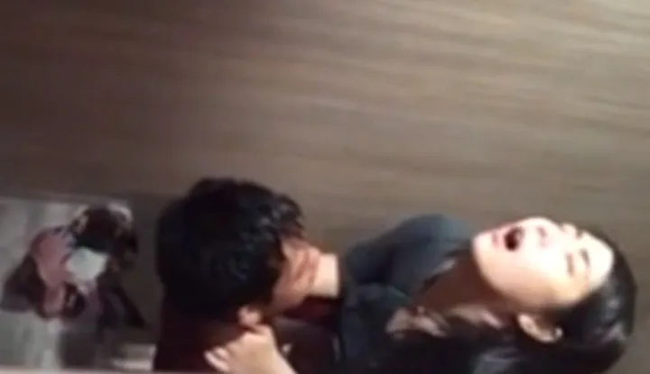 Intoxicated couple engage in wild sex in nightclub restroom.
